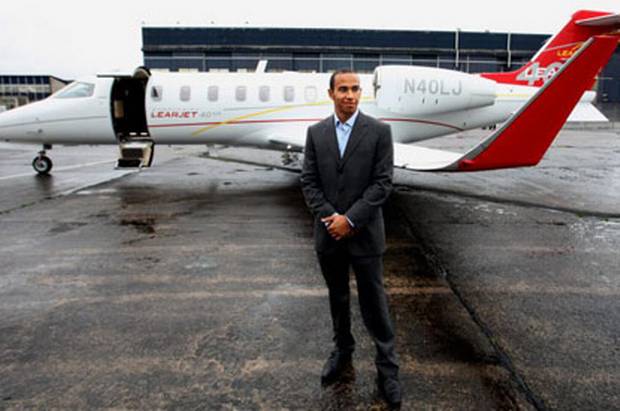 Lewis+Hamilton+in+front+of+a+private+jet