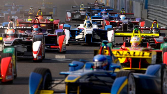 Formula E cars drive into a corner during the Formula E Championship race in Beijing