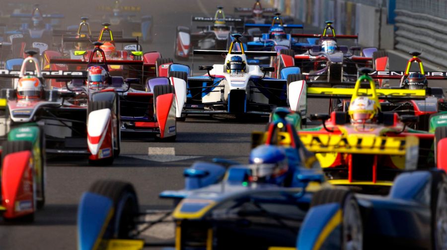 Formula E cars drive into a corner during the Formula E Championship race in Beijing